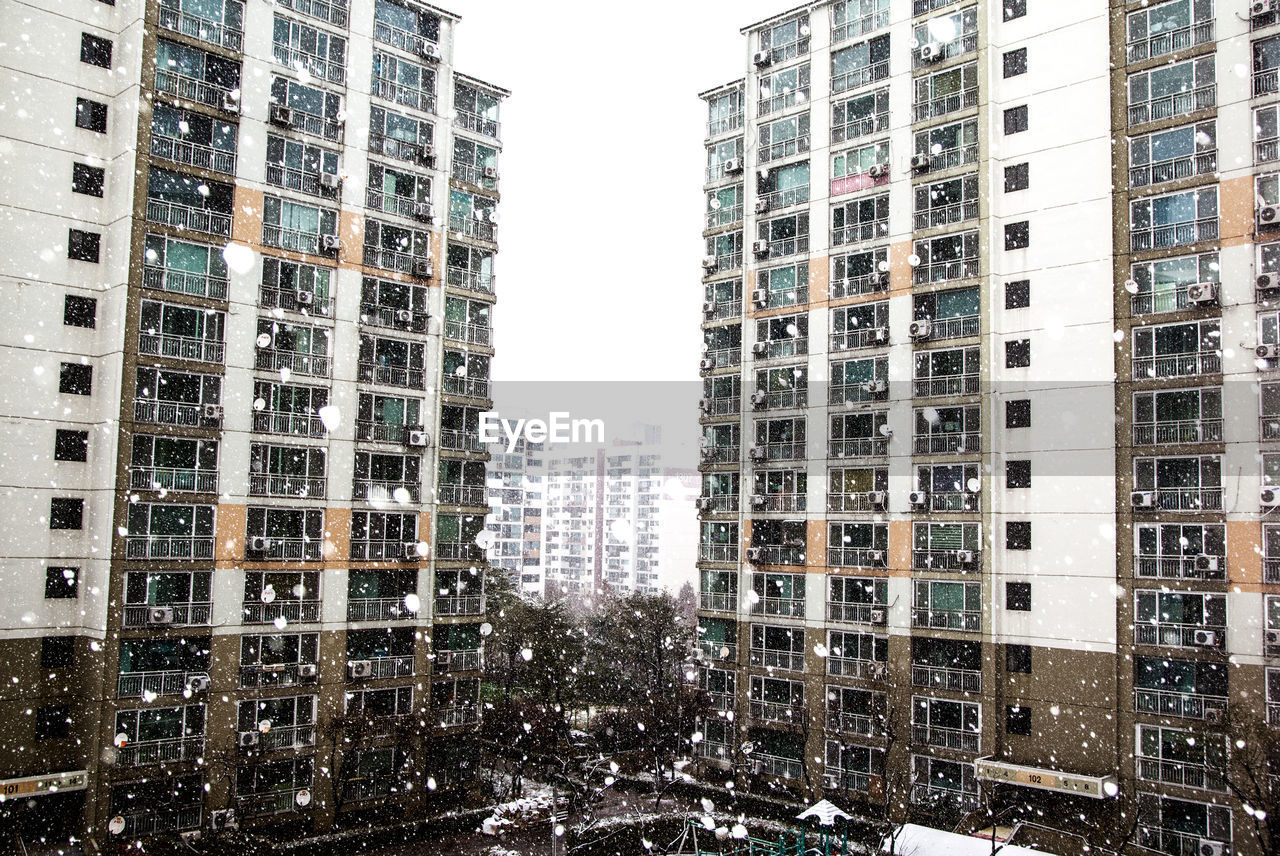 Buildings in city during blizzards