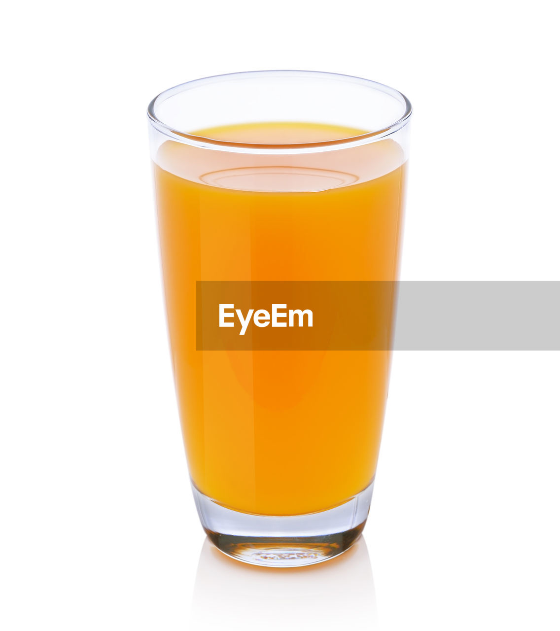 Full glass of orange juice on white background