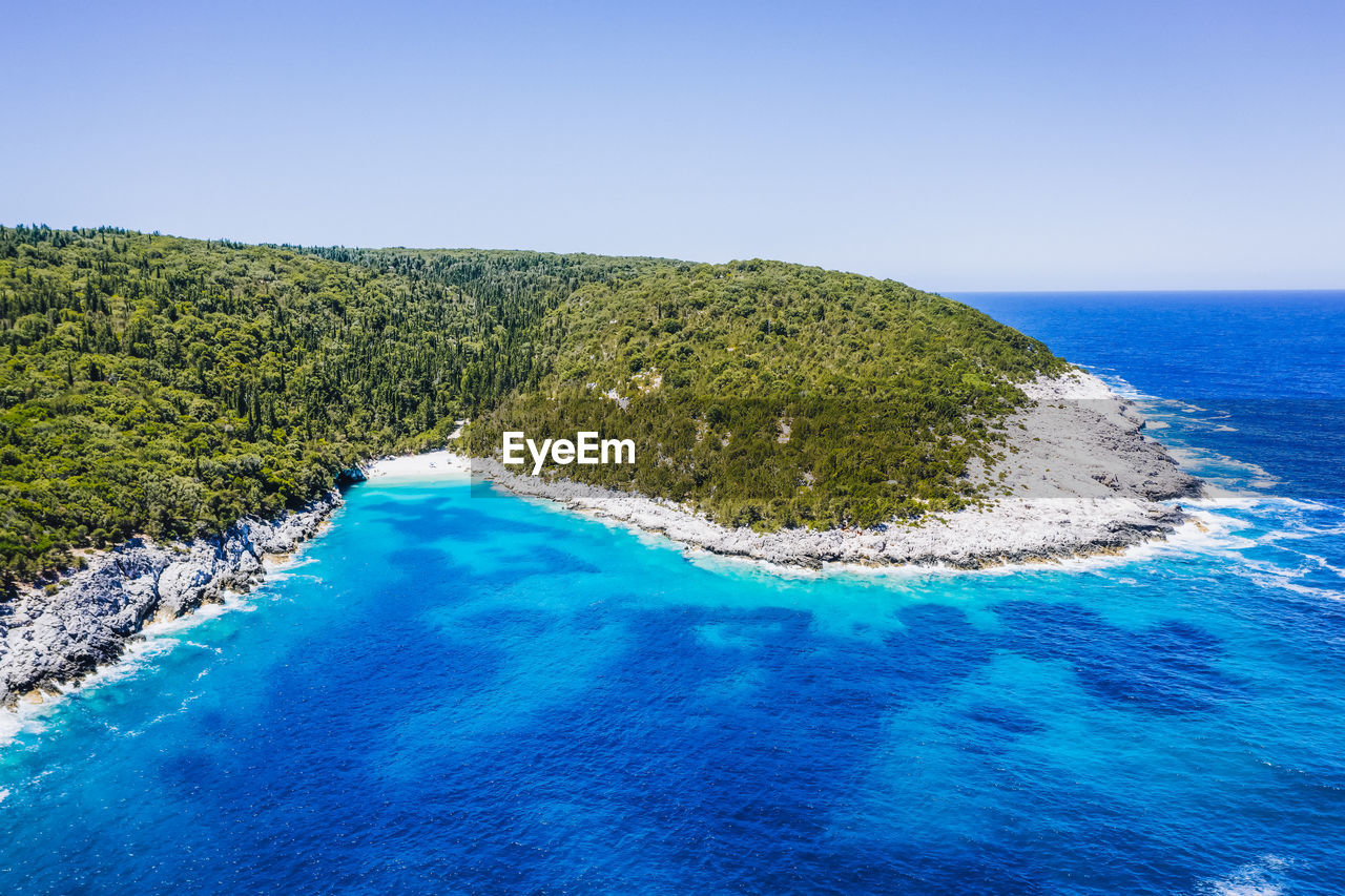 SCENIC VIEW OF SWIMMING POOL BY SEA AGAINST CLEAR BLUE SKY