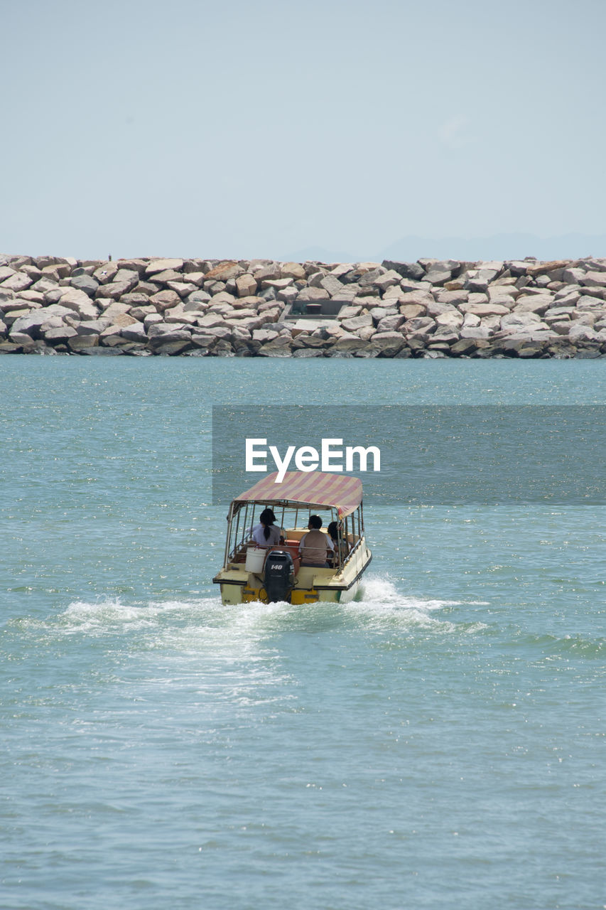 Boat in sea against clear sky