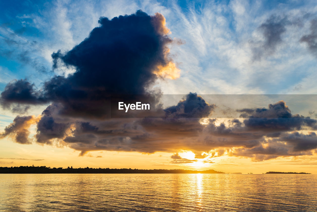 SCENIC VIEW OF SEA AGAINST ORANGE SKY