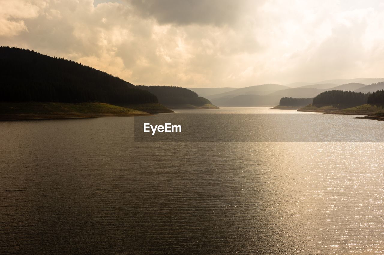 Scenic view of sea against cloudy sky