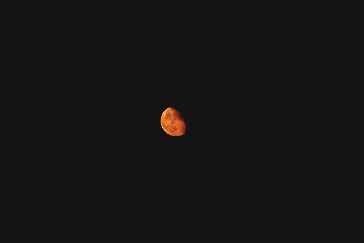 LOW ANGLE VIEW OF MOON IN SKY AT NIGHT