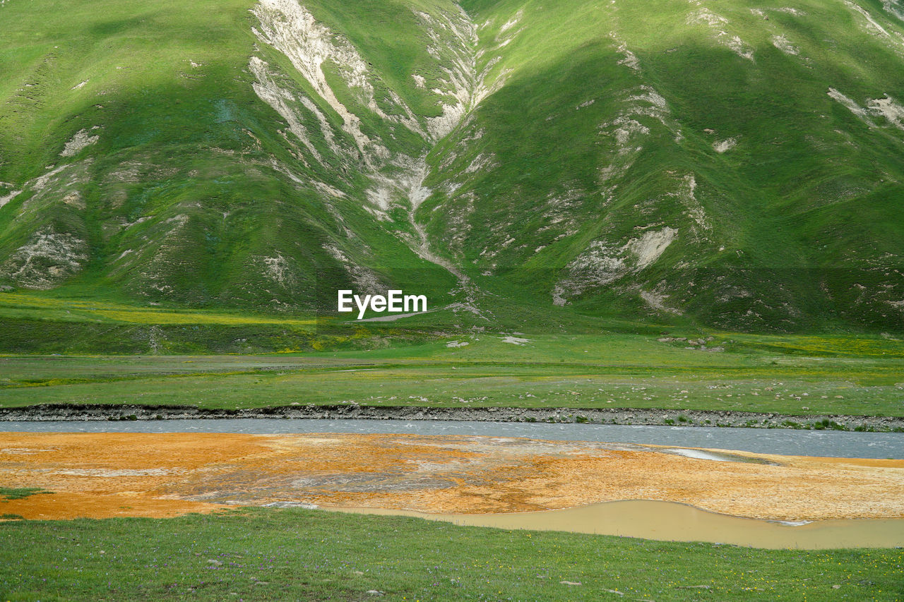 High angle view of terek river with red minerals