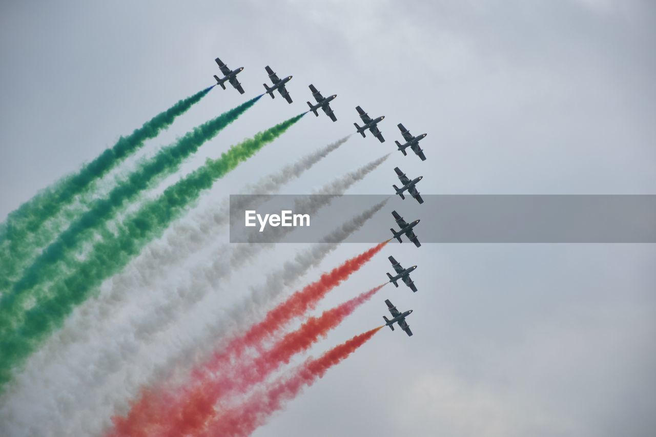 LOW ANGLE VIEW OF AIRPLANE AGAINST SKY