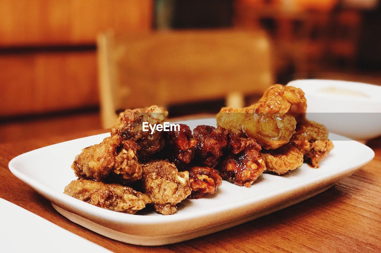 CLOSE-UP OF SERVING FOOD ON PLATE
