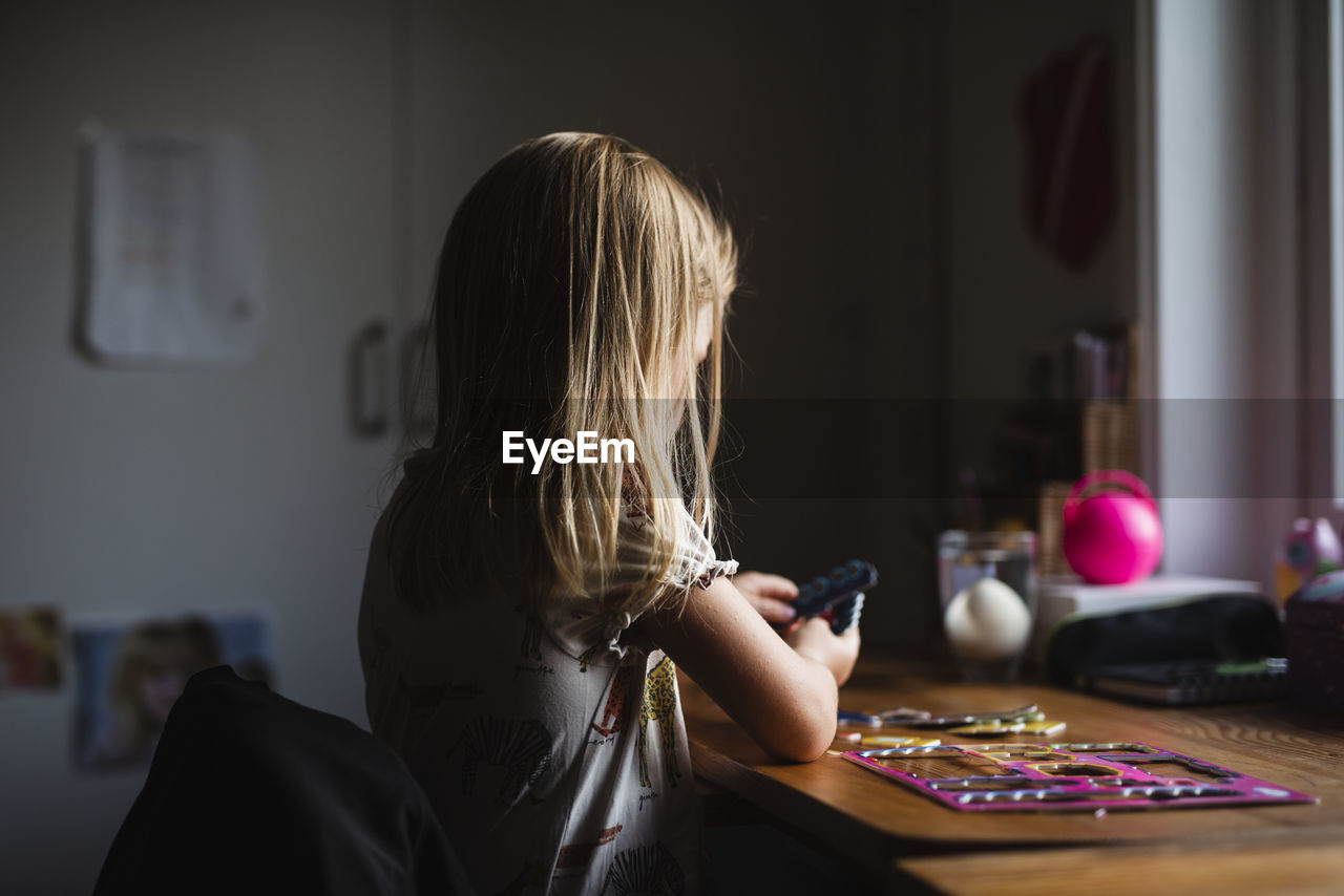 Girl sitting at desk