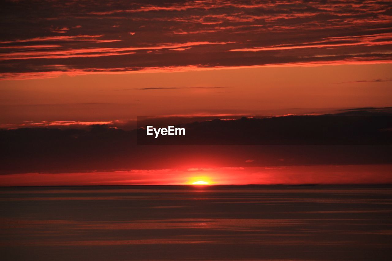 SCENIC VIEW OF SEA AGAINST ROMANTIC SKY