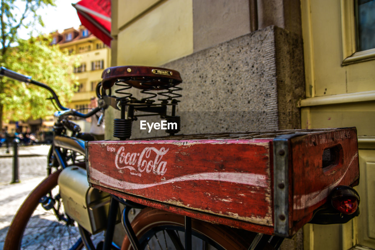 CLOSE-UP OF BICYCLE PARKED IN CITY