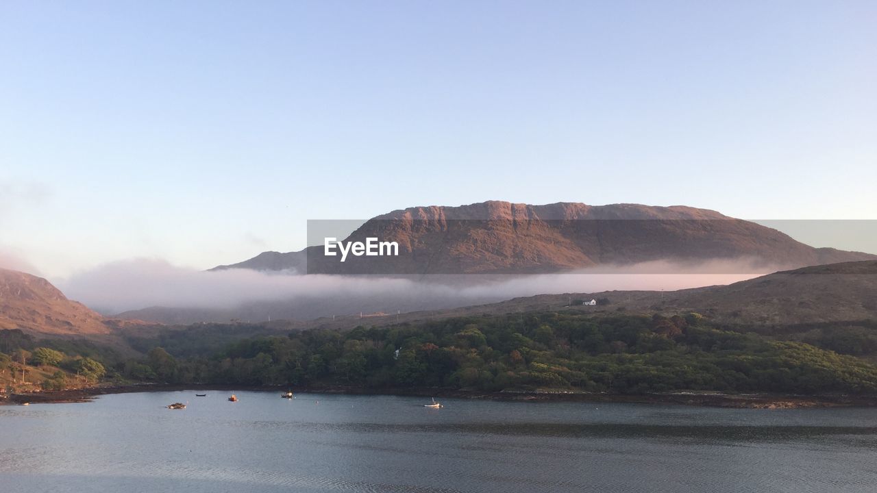 View of lake with mountain range in background