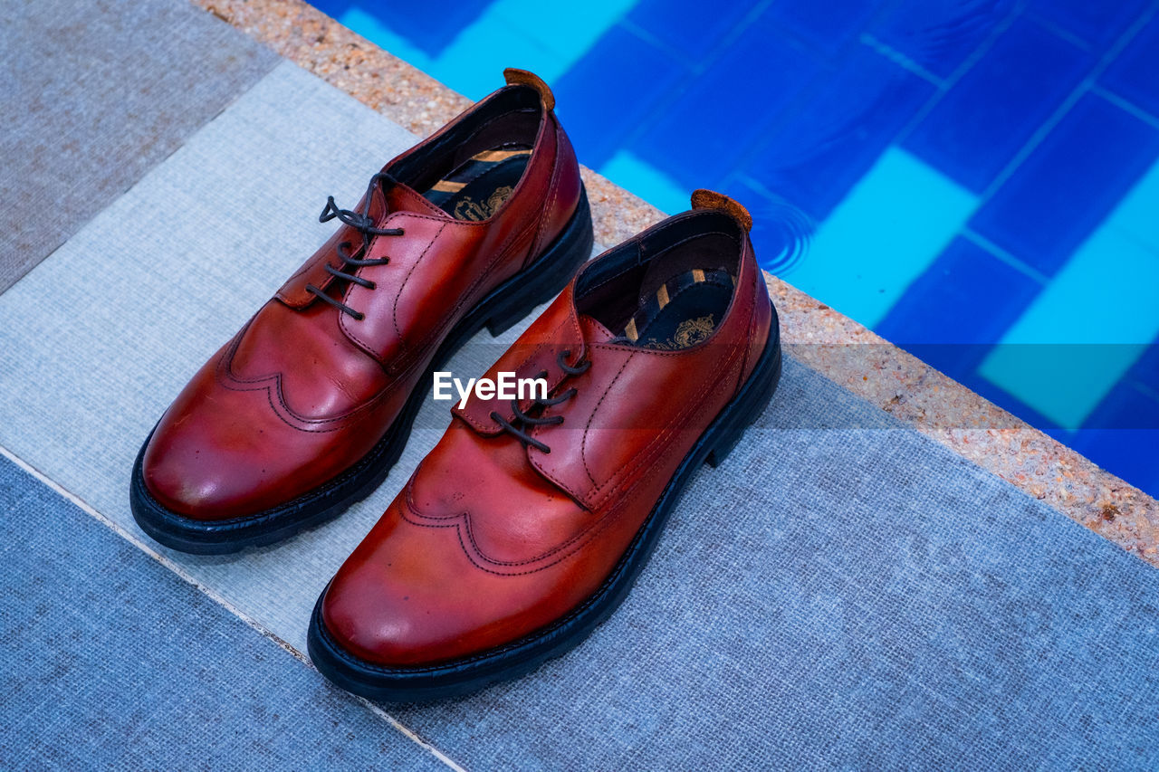 footwear, shoe, red, pair, blue, leather, no people, spring, sneakers, close-up, fashion, still life, high angle view, flooring, indoors, sports, oxford shoe, brown, limb