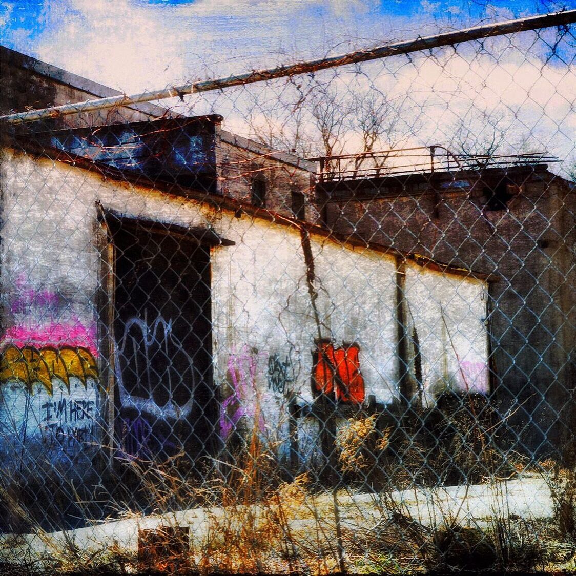 VIEW OF CHAINLINK FENCE AGAINST SKY