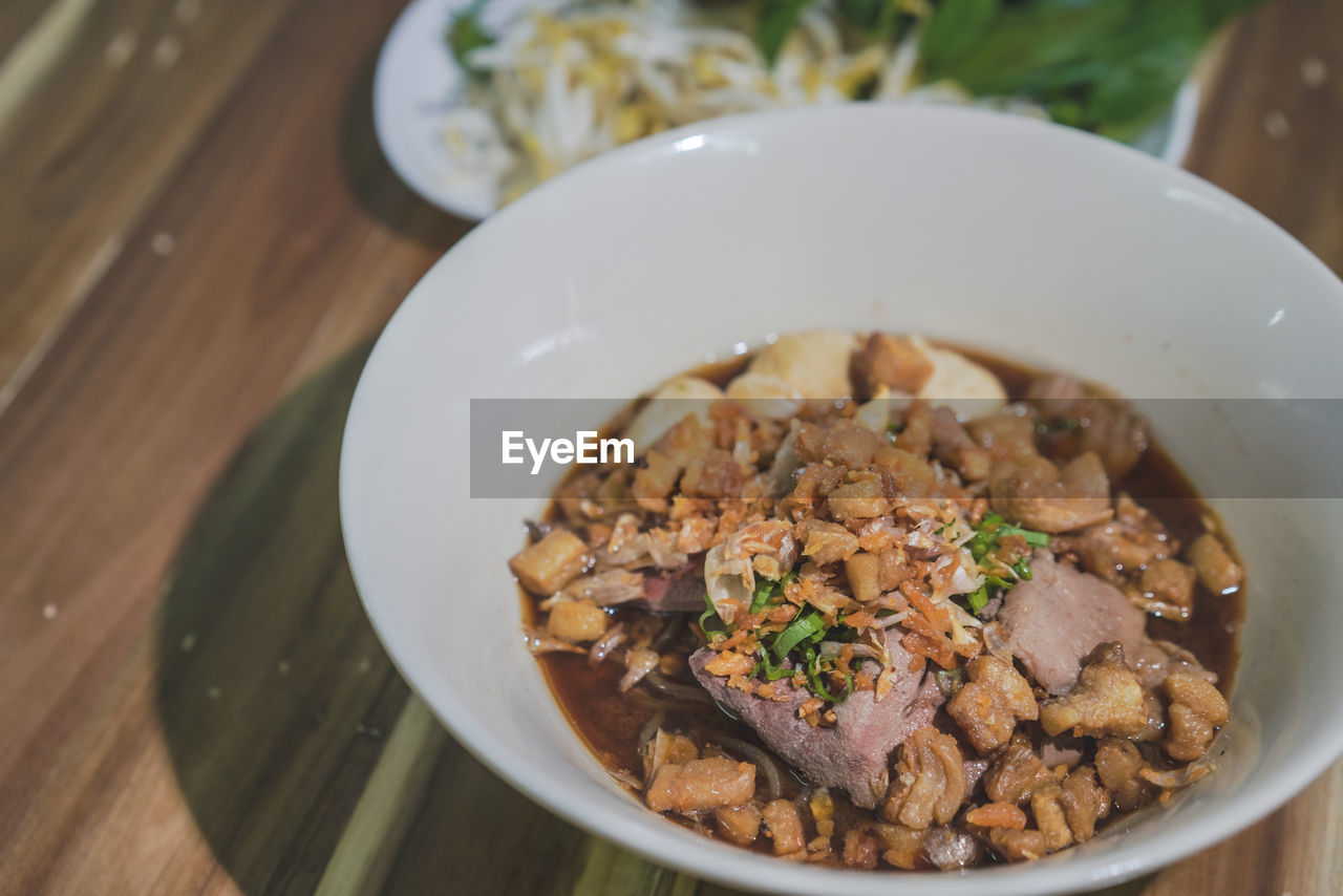 food and drink, food, healthy eating, dish, meal, wellbeing, table, bowl, freshness, no people, cuisine, indoors, wood, meat, produce, vegetable, high angle view, breakfast, close-up, asian food, still life