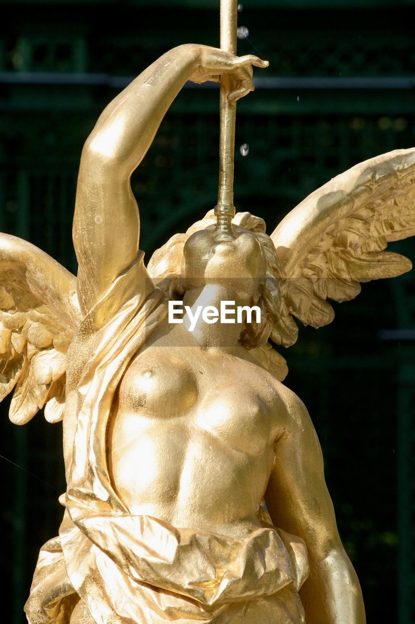 Close-up of golden angel statue