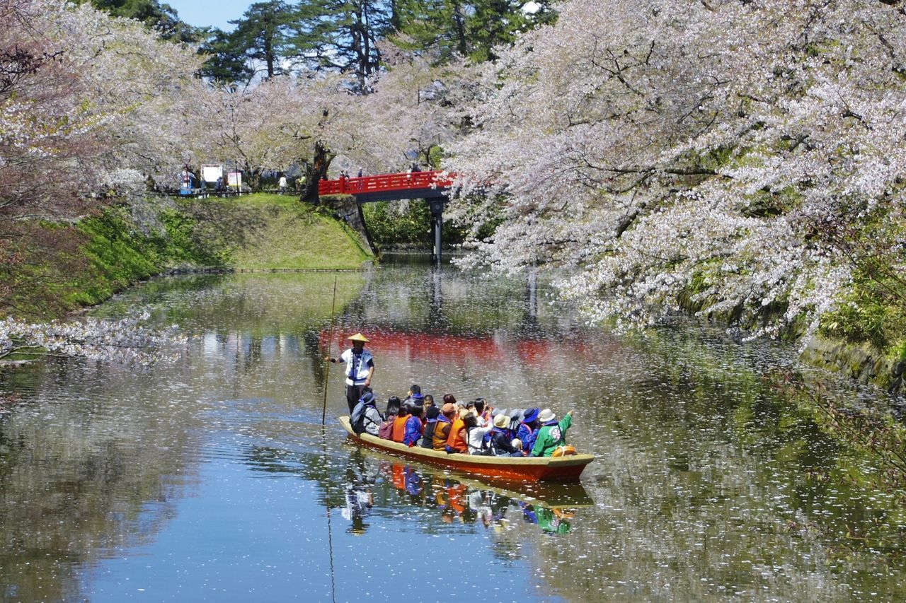 PEOPLE SITTING IN RIVER