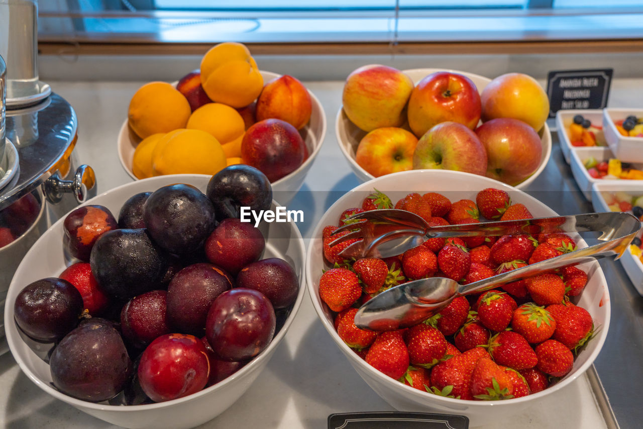 Assortment of colorful fresh fruits at breakfast buffet in hotel