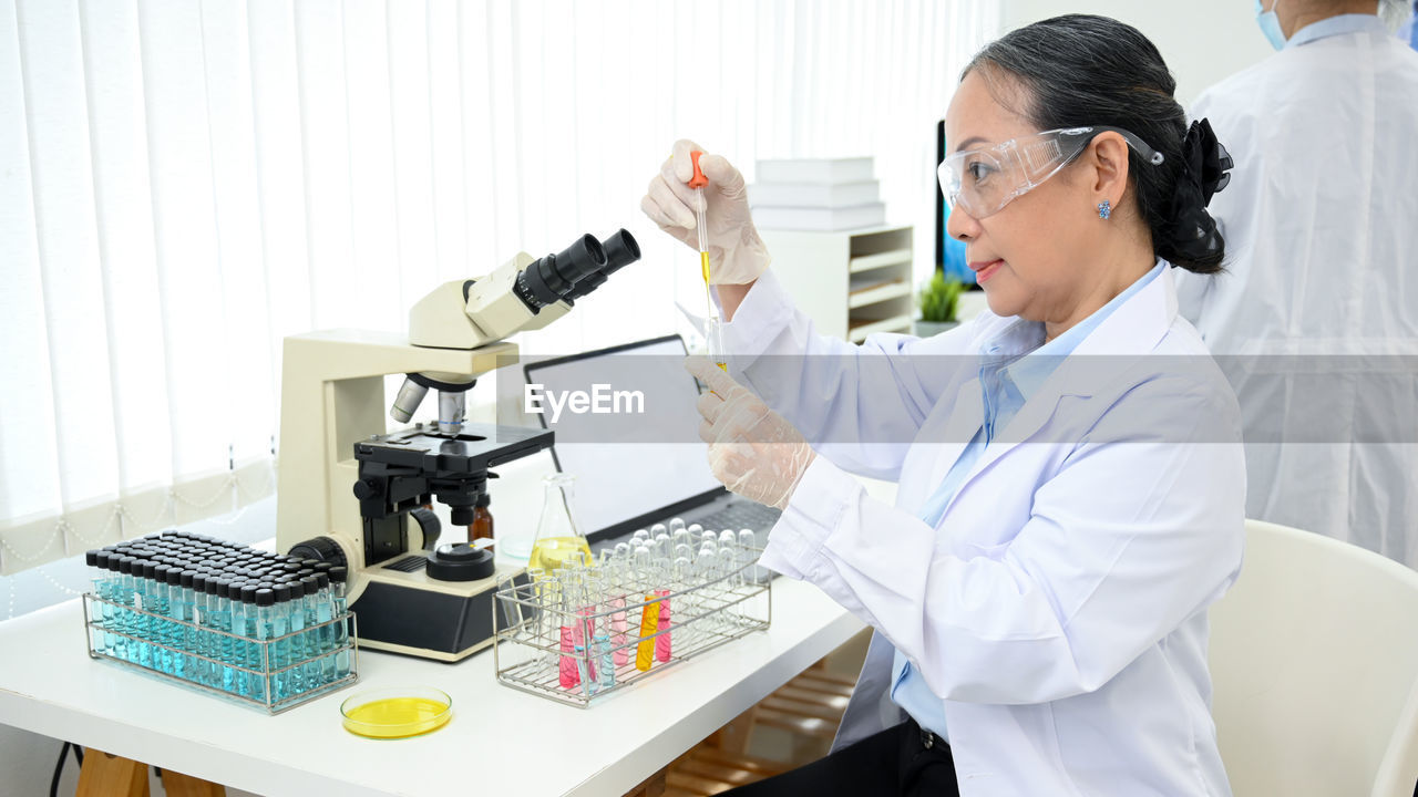 female dentist working at laboratory