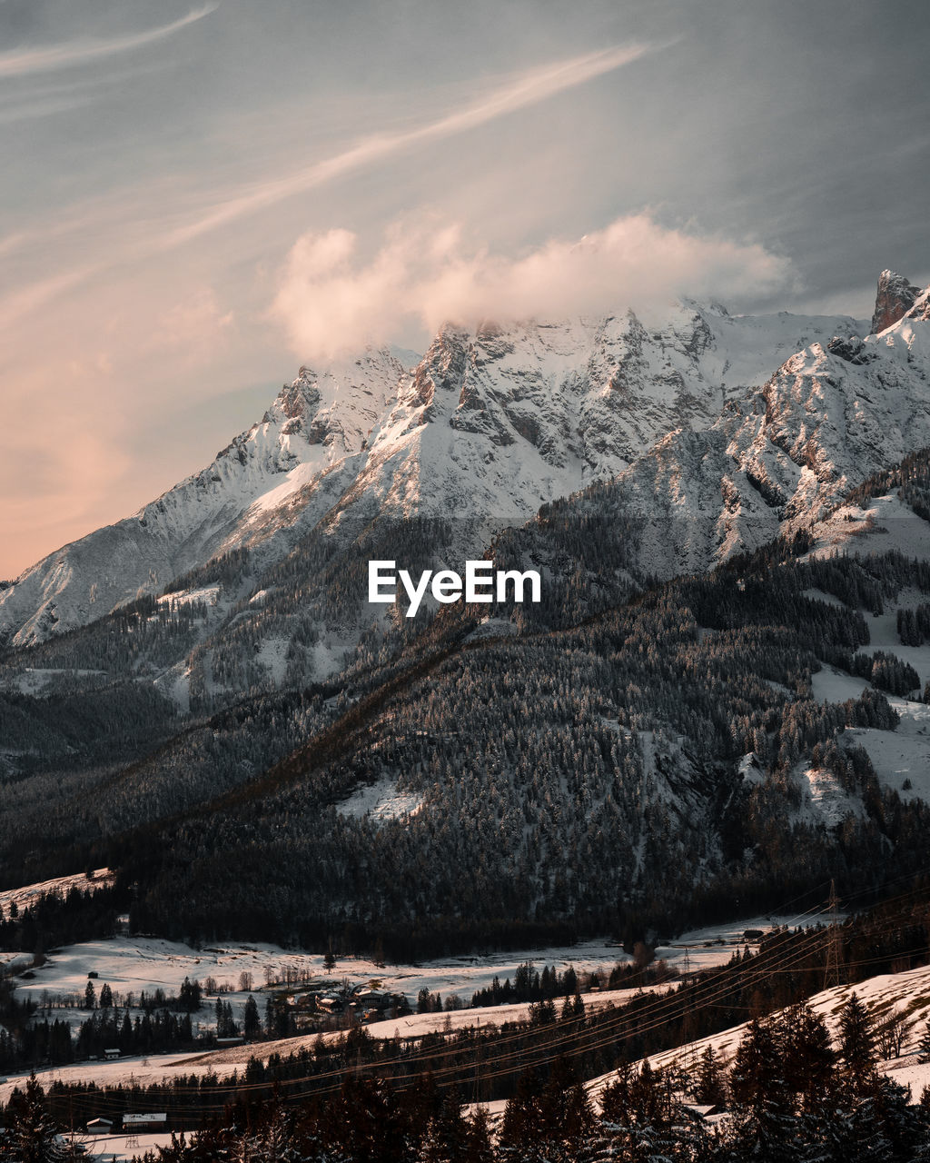 high angle view of snowcapped mountains against sky during sunset