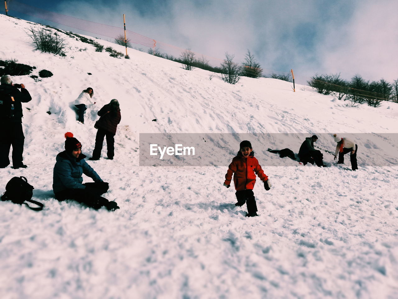 People on snow covered field