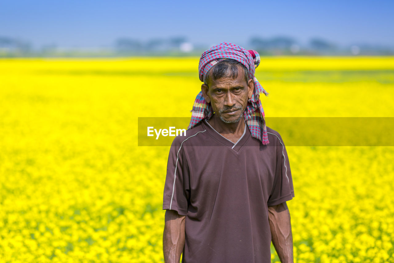 PERSON STANDING ON FIELD