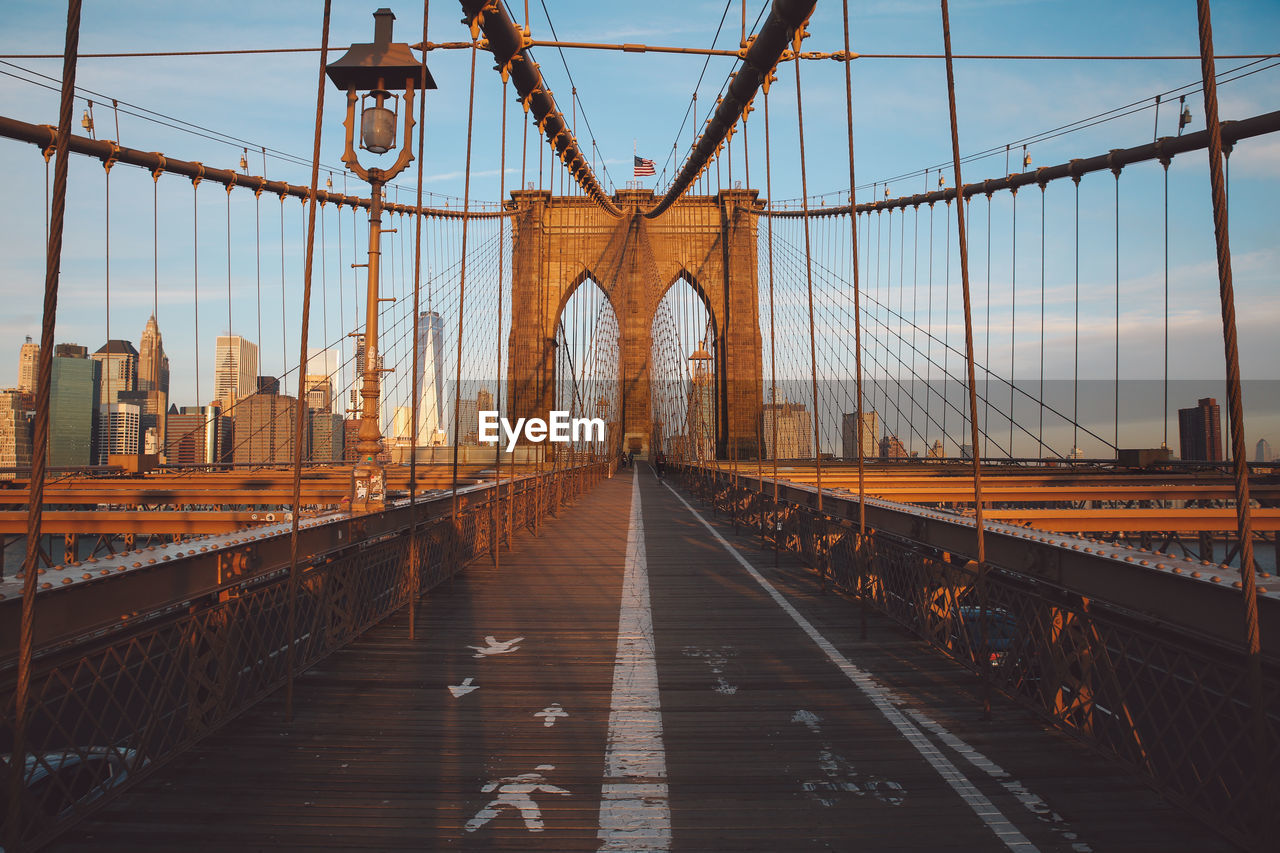 Road marking and arrow symbols on brooklyn bridge in city