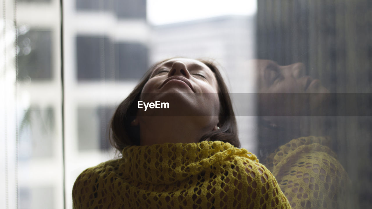 Close-up of young woman with eyes closed