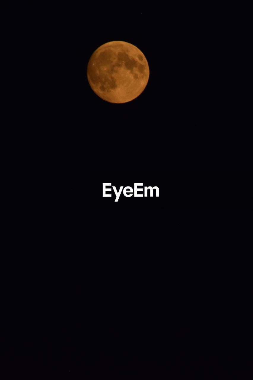 LOW ANGLE VIEW OF FULL MOON AGAINST SKY AT NIGHT