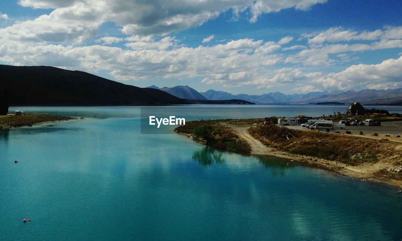 Scenic view of calm sea against cloudy sky