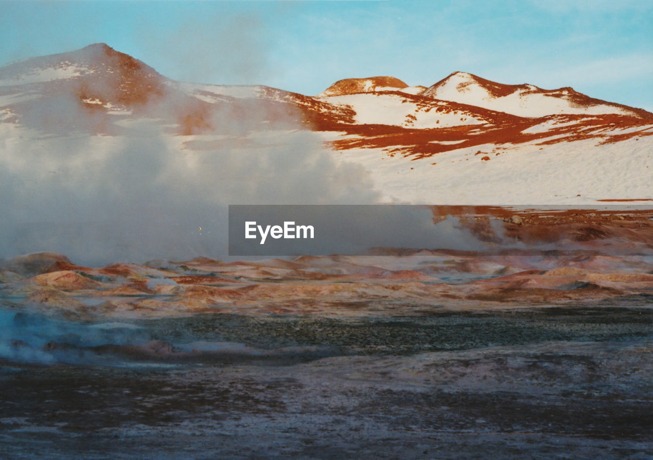 View of volcanic landscape against sky