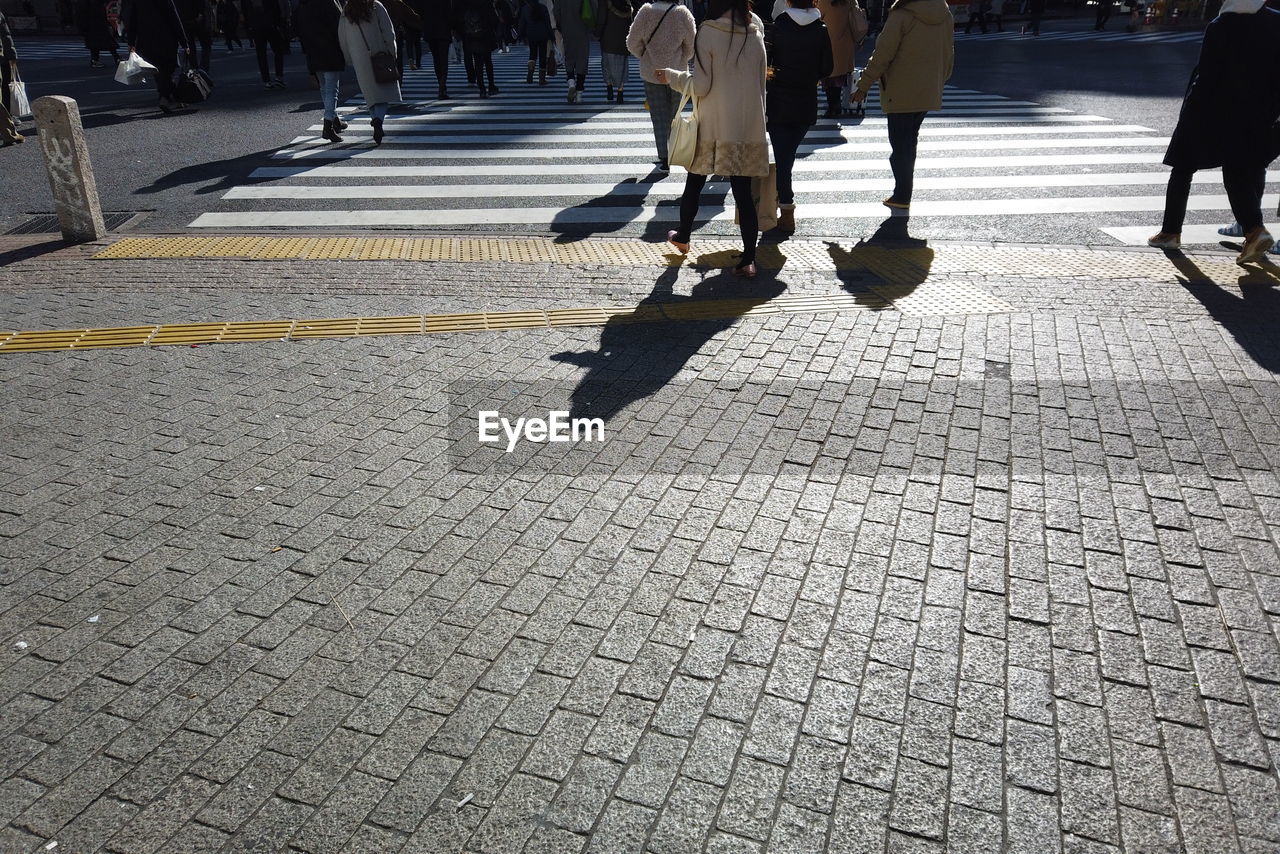 Low section of people on city street