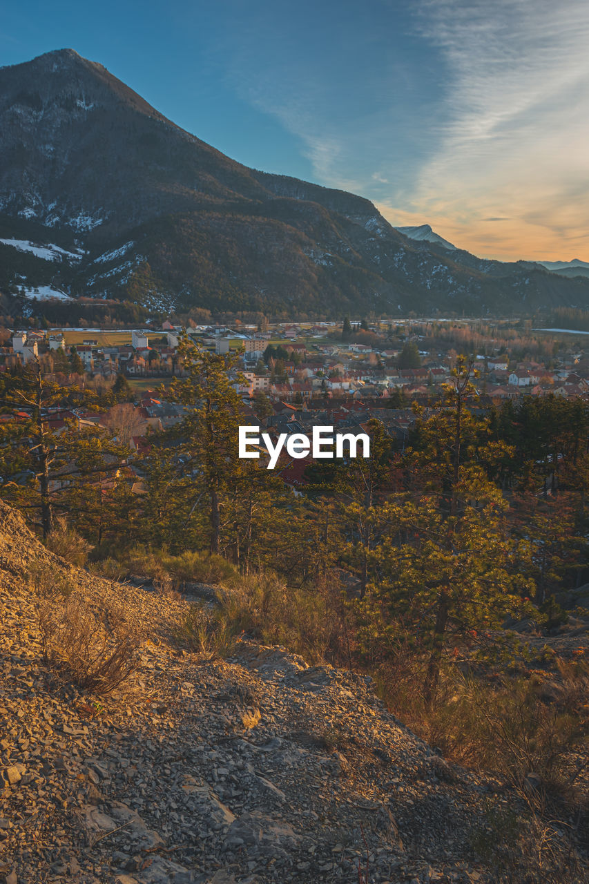 A panoramic vertical landscape view of veynes, an old town in the french alps, during the sunset