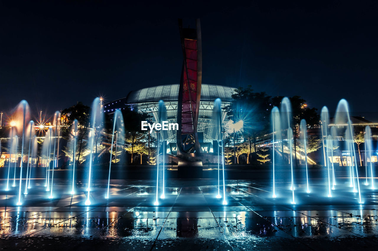 ILLUMINATED FOUNTAIN AT NIGHT