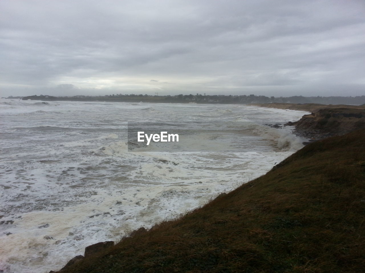 VIEW OF SEA AGAINST CLOUDY SKY