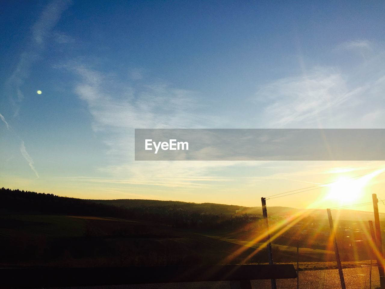 Scenic view of landscape against sky during sunset