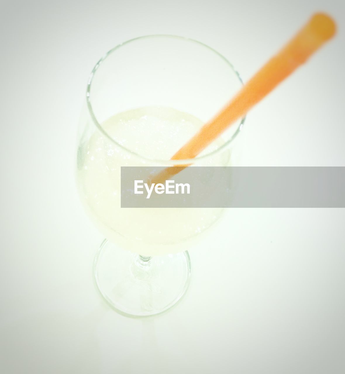 High angle view of drink in wineglass against white background