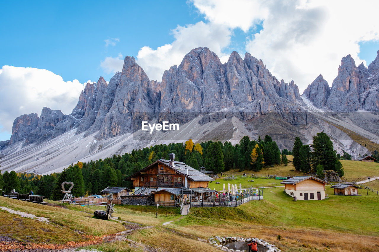 houses on mountain against sky