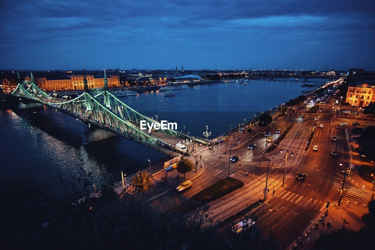 HIGH ANGLE VIEW OF BRIDGE OVER RIVER AGAINST SKY