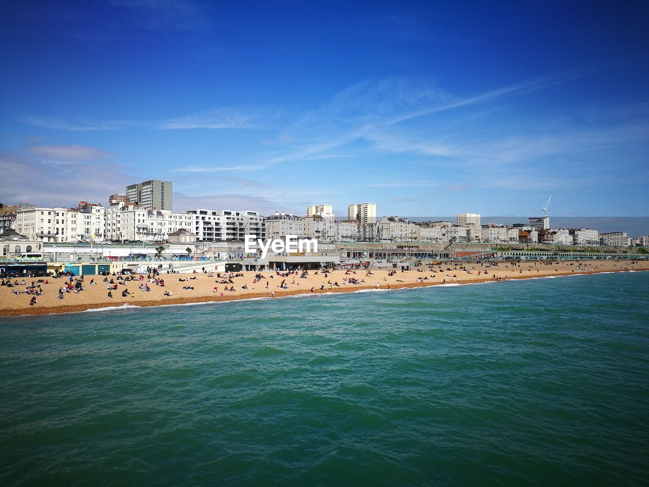 View of sea with cityscape in background