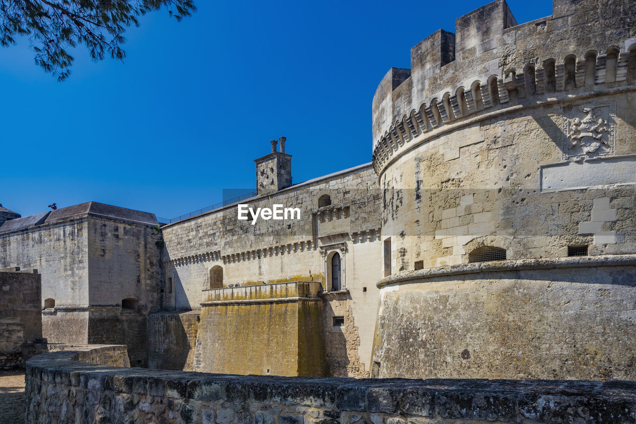 LOW ANGLE VIEW OF FORT AGAINST BLUE SKY