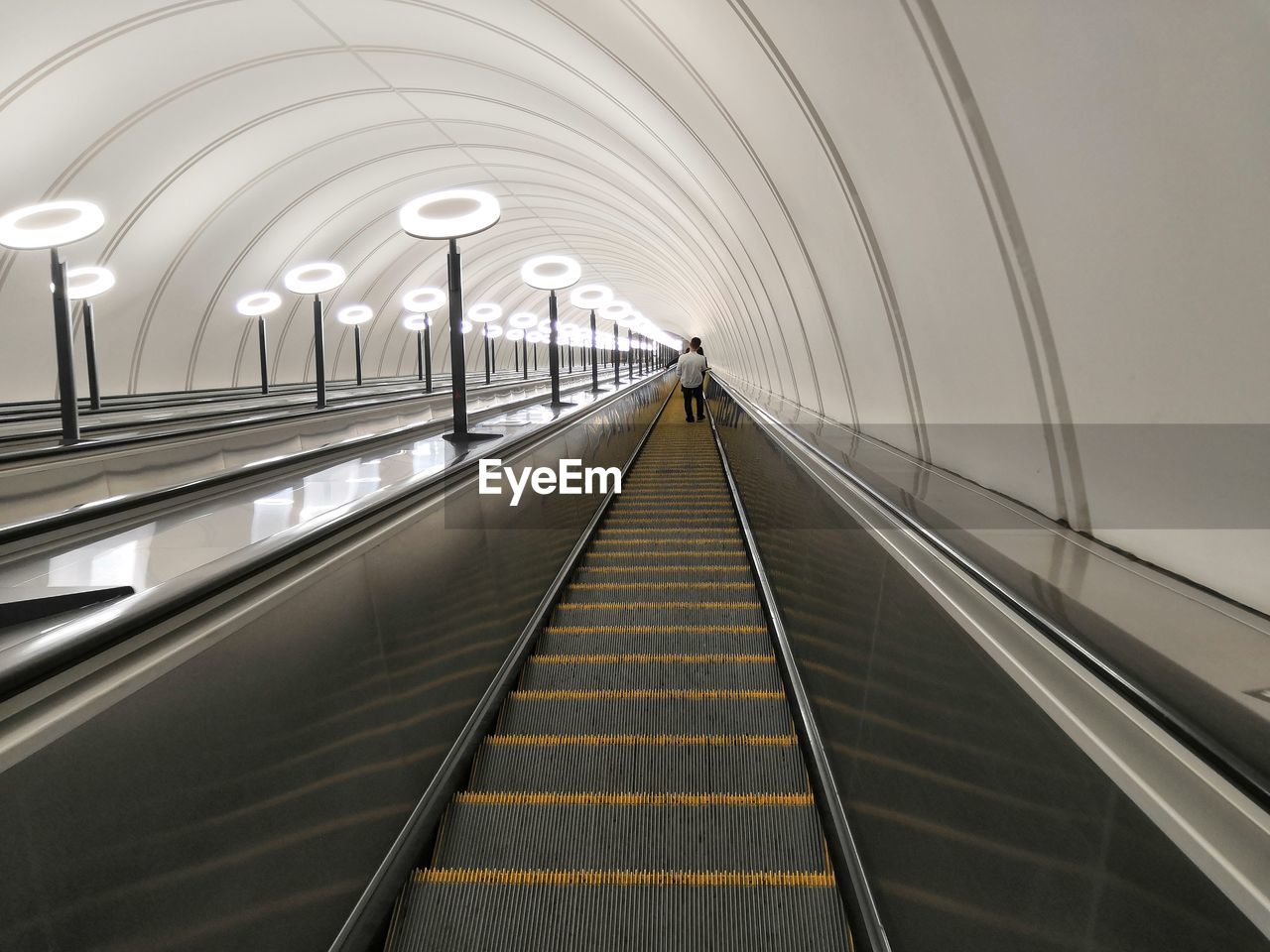 LOW ANGLE VIEW OF ESCALATOR IN UNDERGROUND