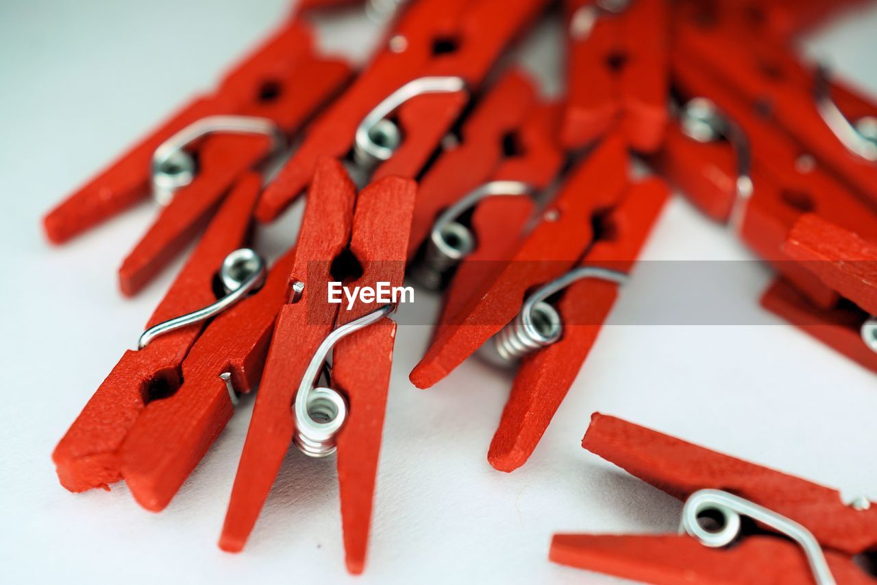 High angle view of red clothes pins 