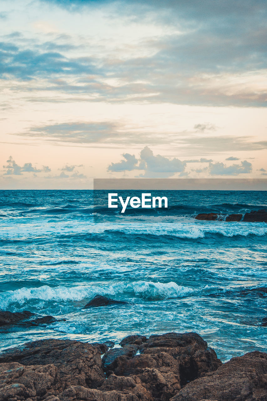 Scenic view of sea against sky during sunset