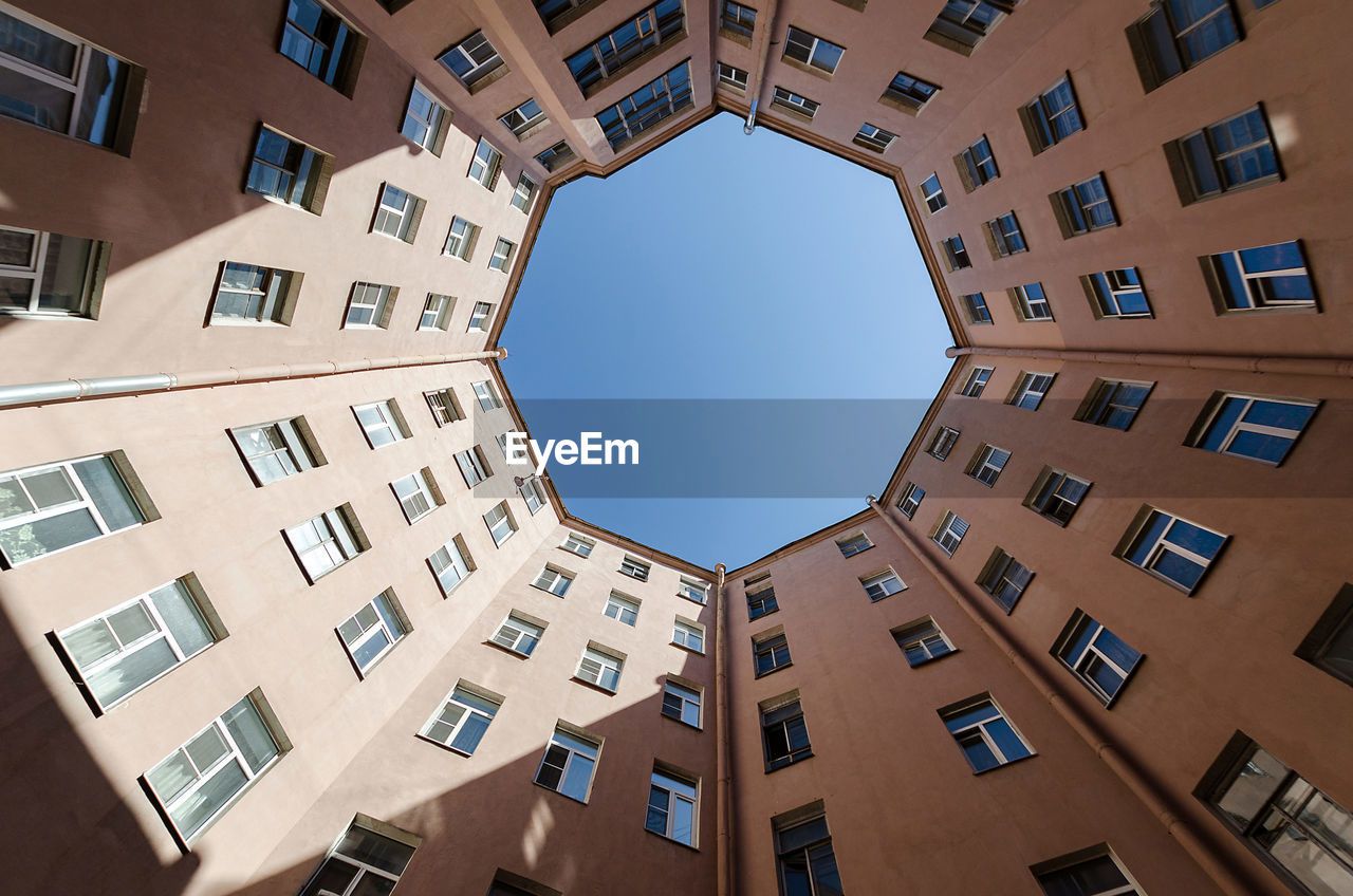 Octagon shape house courtyard. bottom view octagon building in saint petersburg