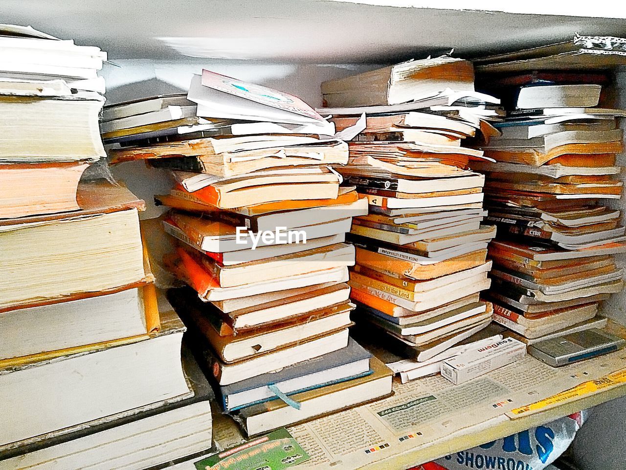 book, stack, large group of objects, indoors, wood - material, learning, literature, education, no people, library, bookshelf, day