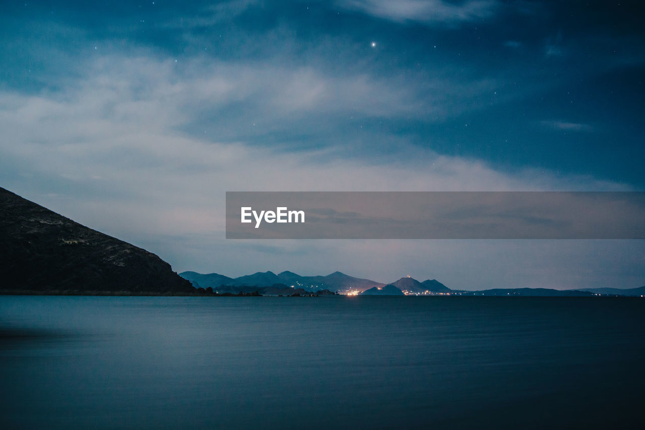 Scenic view of sea against sky at night