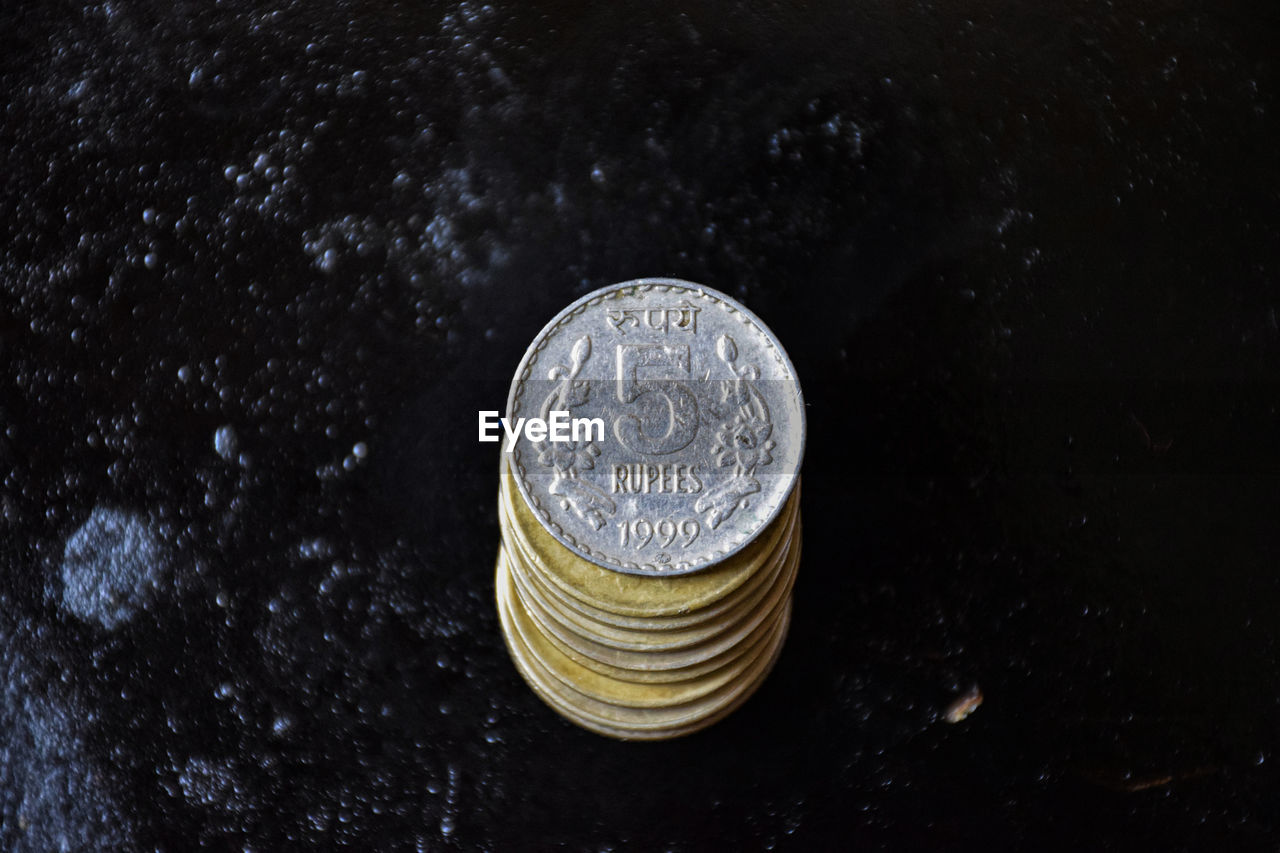 HIGH ANGLE VIEW OF COINS