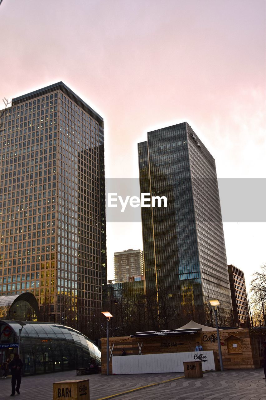 Low angle view of buildings against sky during sunset