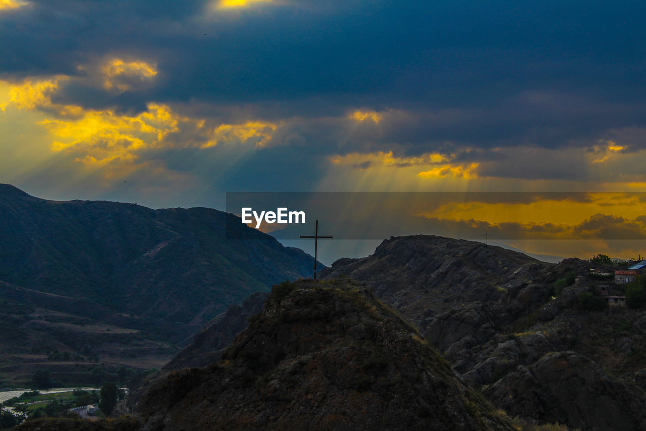 Scenic view of mountains against sky during sunset