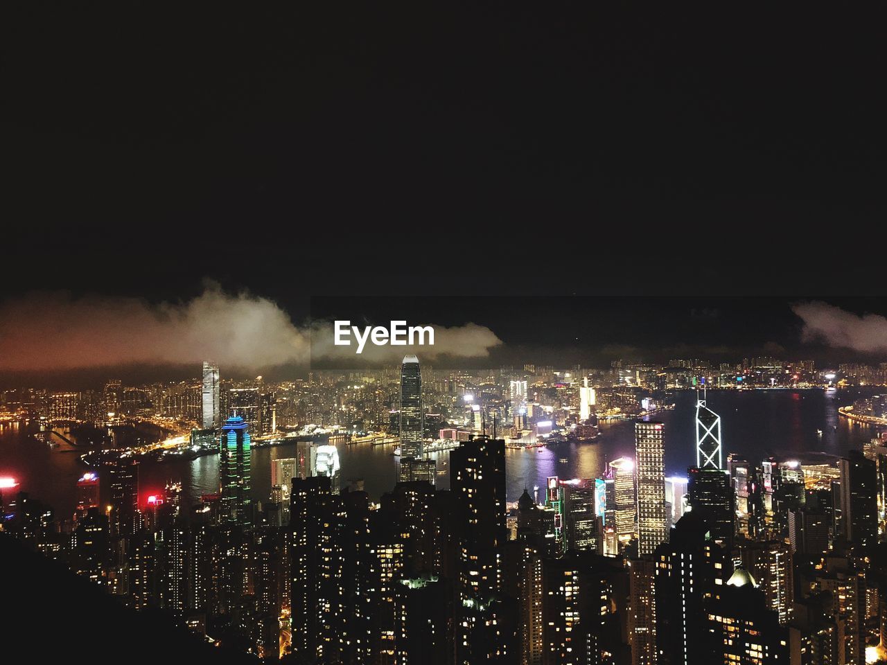 High angle view of illuminated city buildings at night