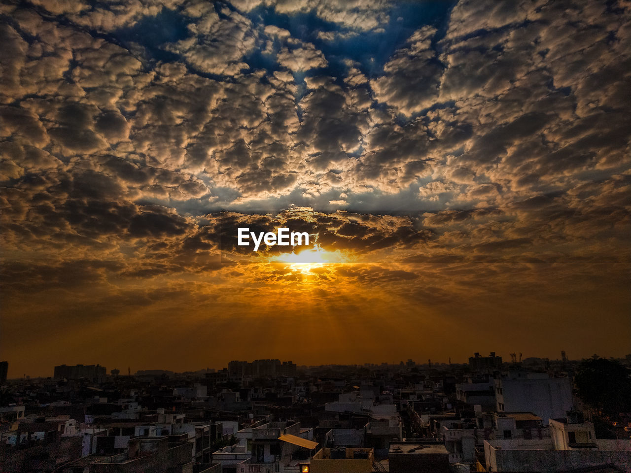 TOWNSCAPE AGAINST SKY DURING SUNSET